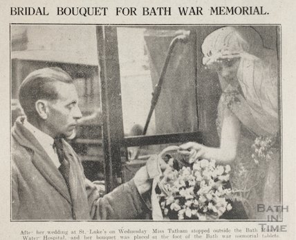 Bride lays bouquet in Union Street